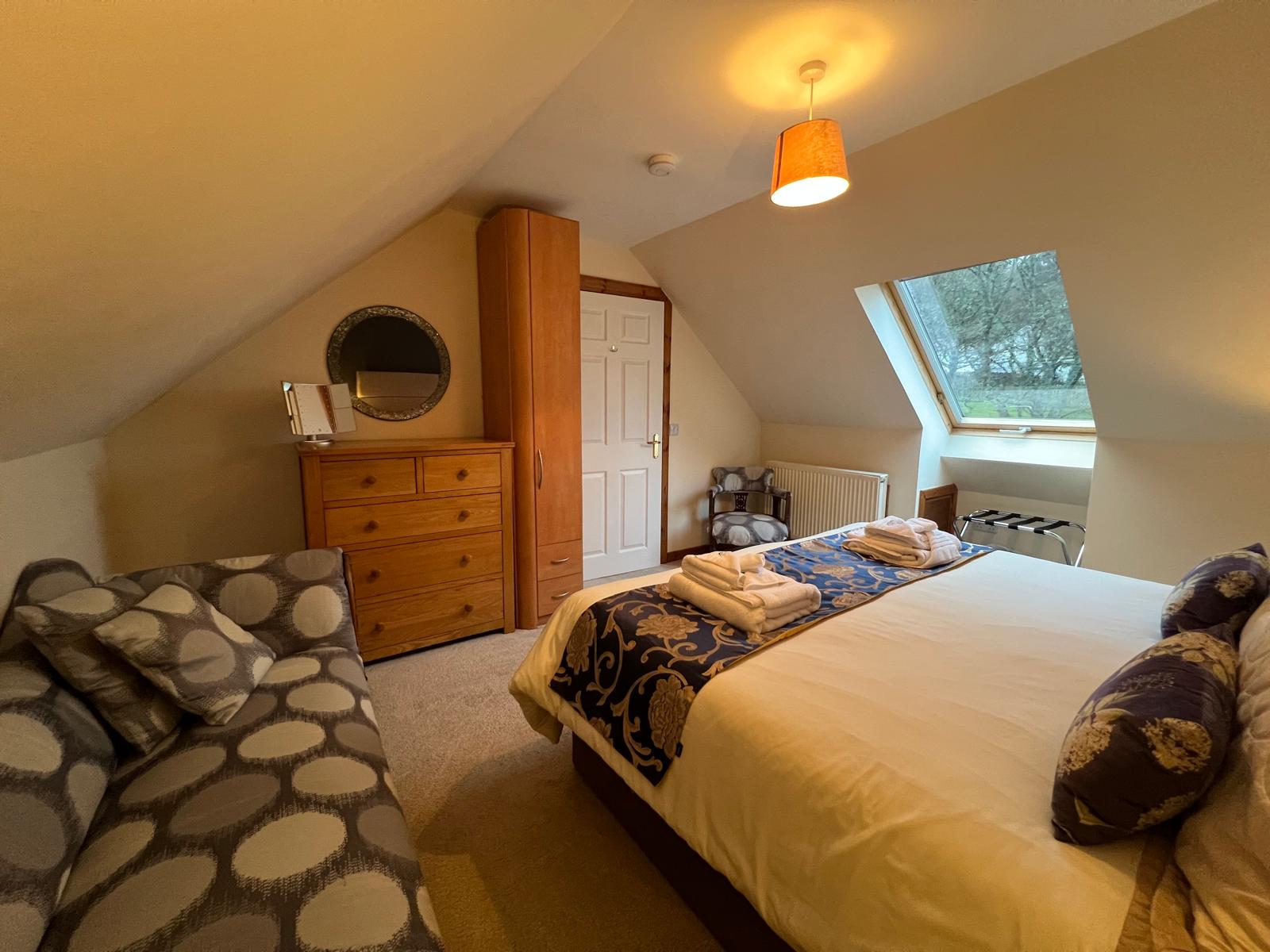 Lindfields bedroom 1 with skylight and wardrobe