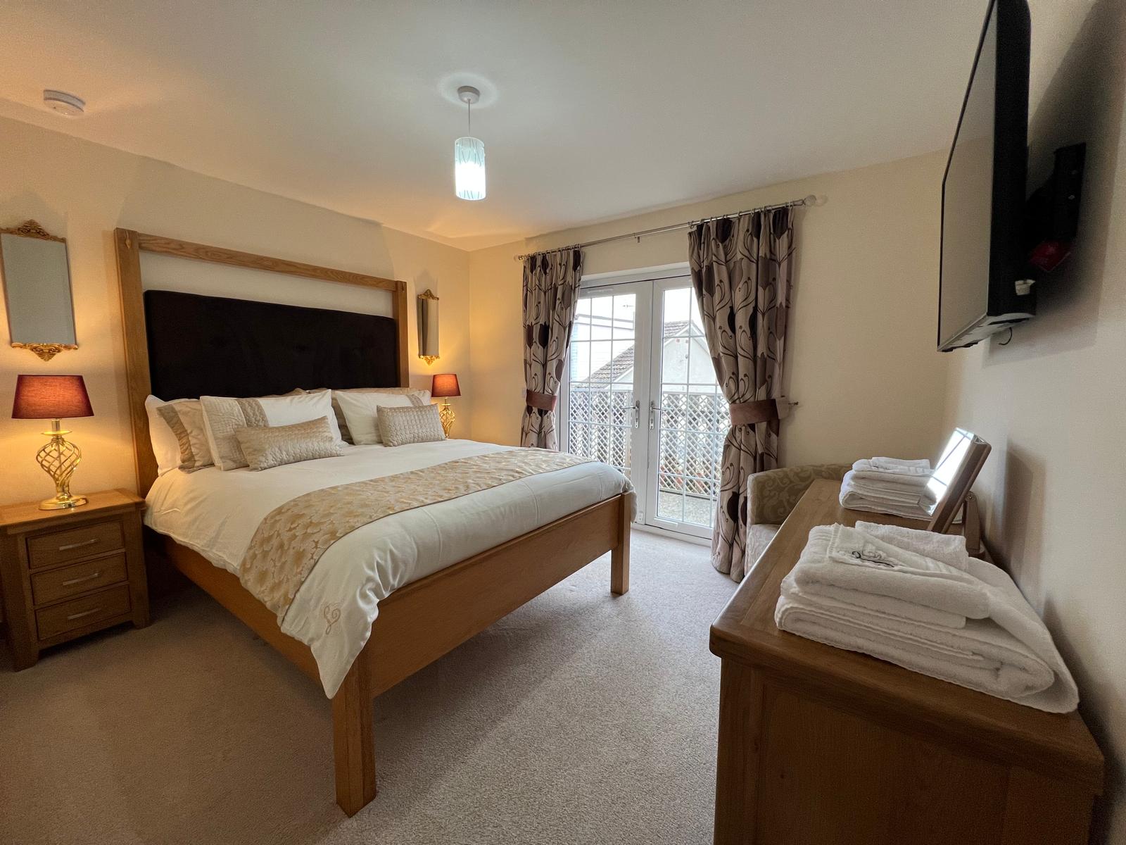 Lindfields king bedroom with french doors