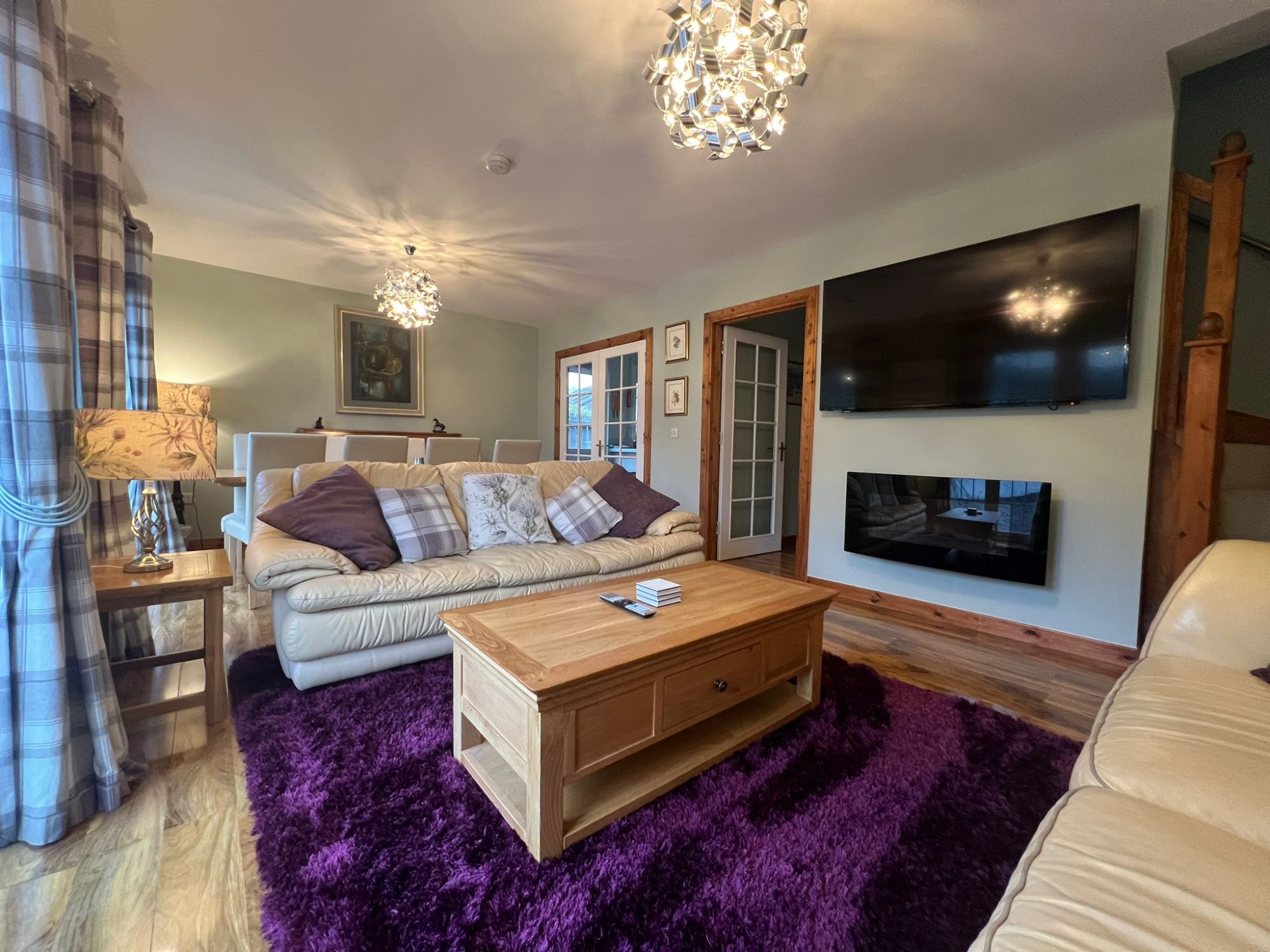 Lindfields lounge with electric fire and large TV